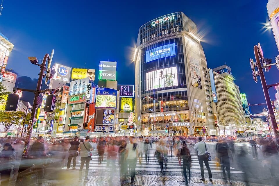 Pedestrians crossing perhaps the most famous scramble intersection in the world, in Shibuya, Tokyo, Japan. Taken from Hachikō square.